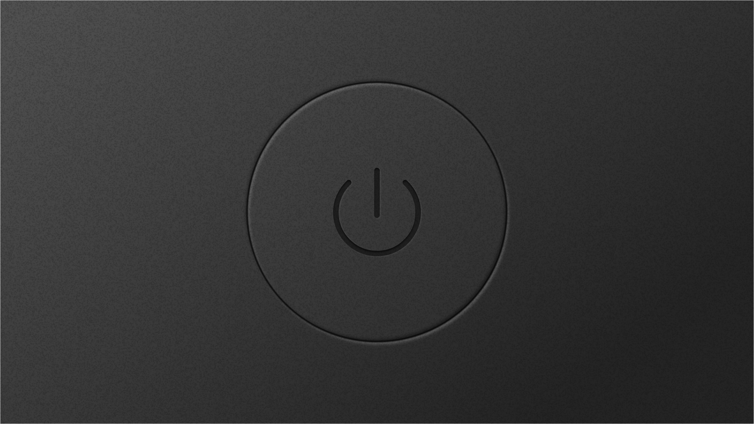 A power button used to turn on a computer, currently off.