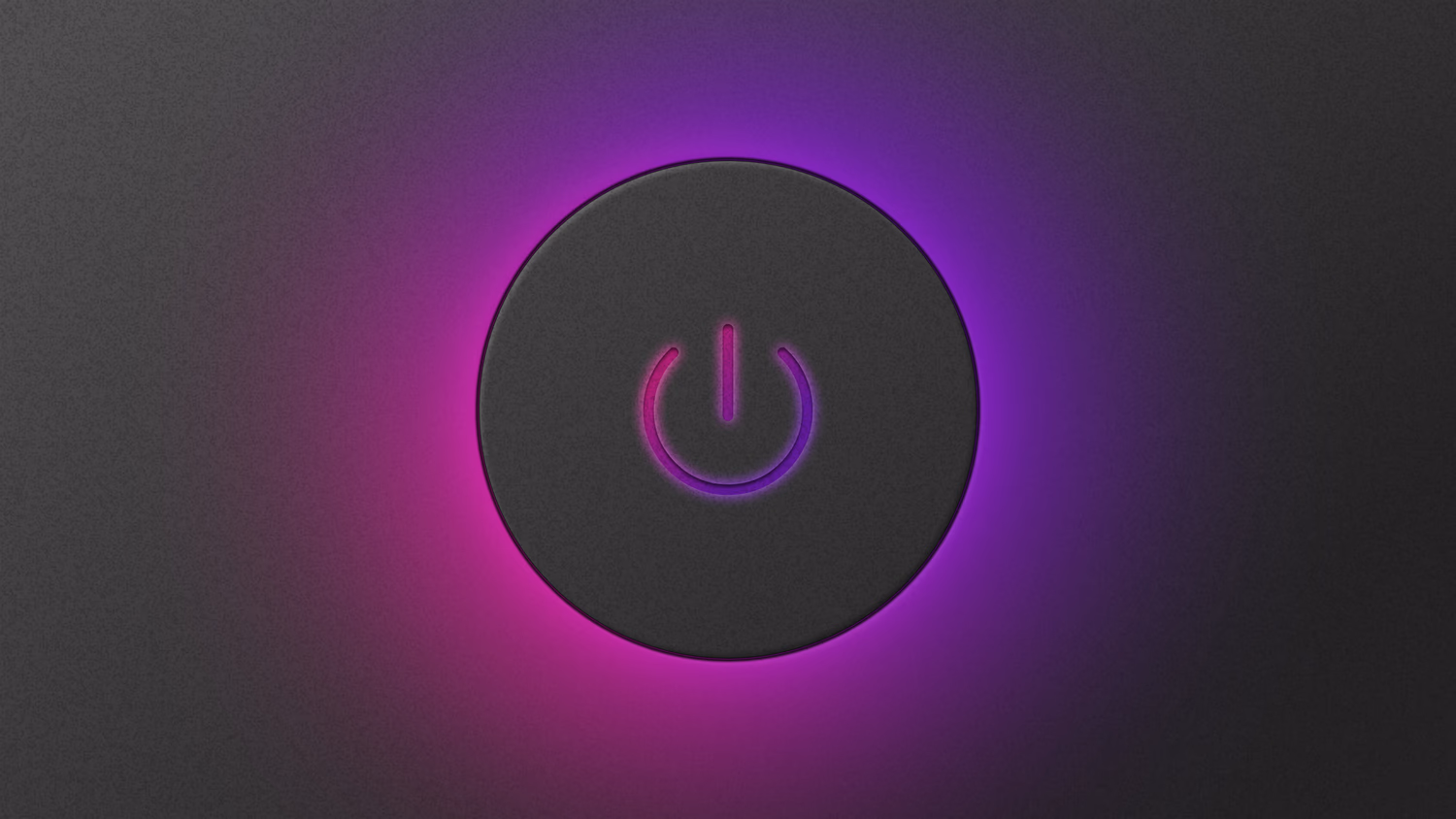 A power button used to turn on a computer, glowing because it has been pressed to turn the computer on.
