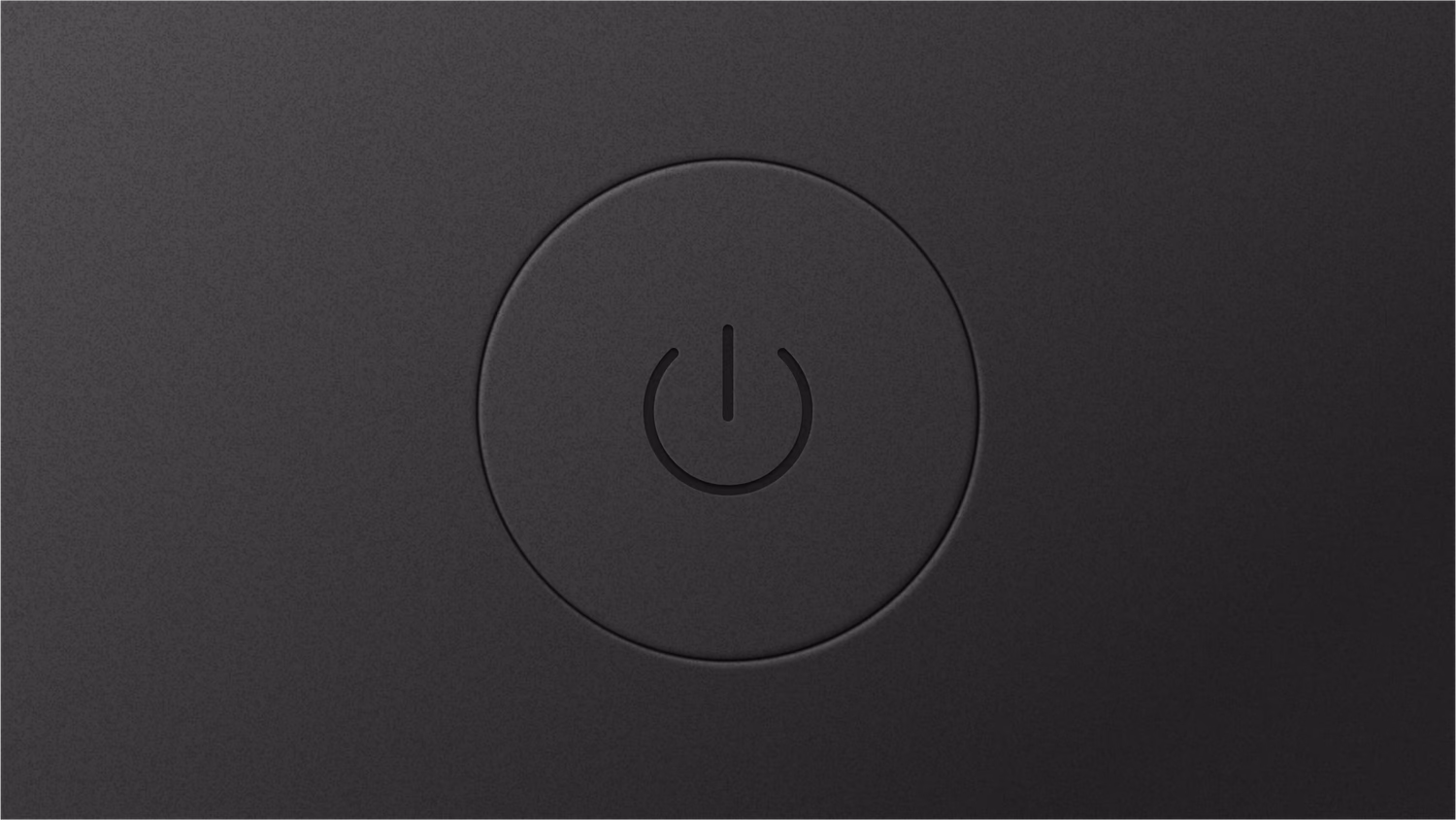 A power button used to turn on a computer, currently off.